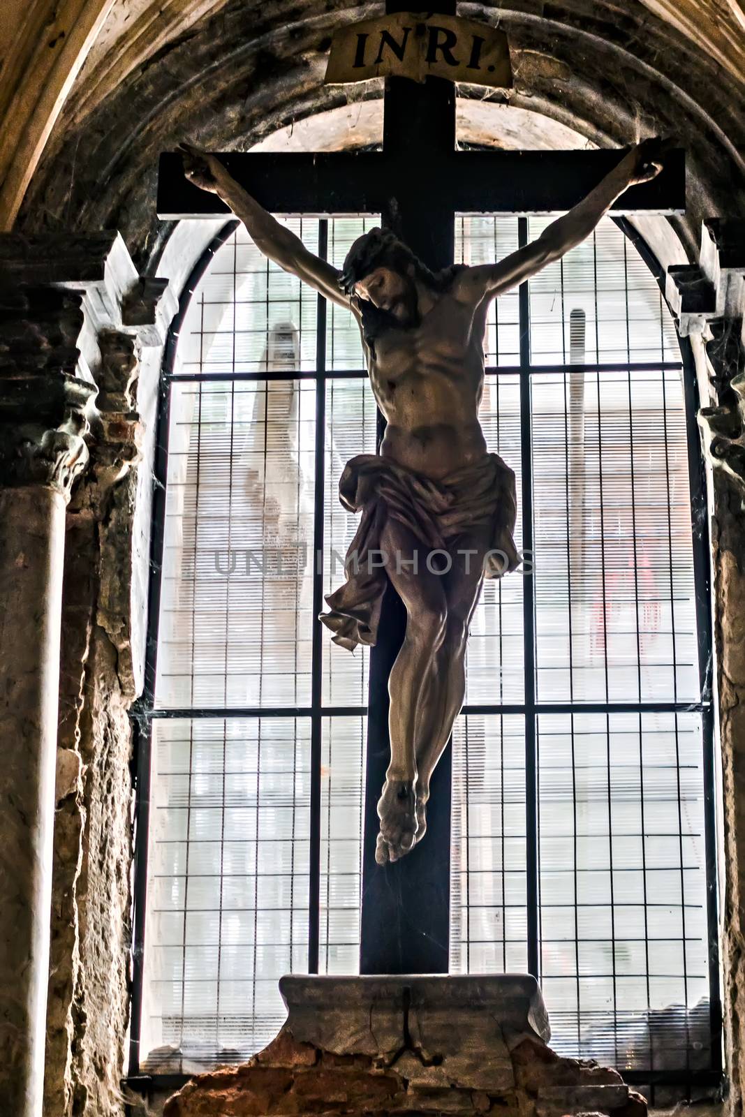 Interior crucifixion of Jesus vintage Christ Sedlec ossuary Kostnice Church a place Kutna Hora, Czech Republic.