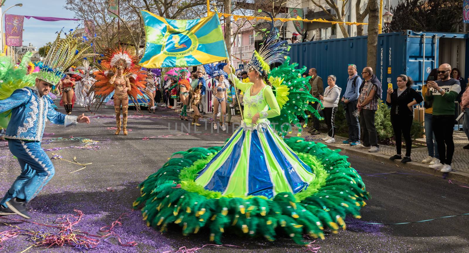 Loule, Portugal - February 25, 2020: dancers parading in the street in front of the public in the parade of the traditional carnival of Loule city on a February day