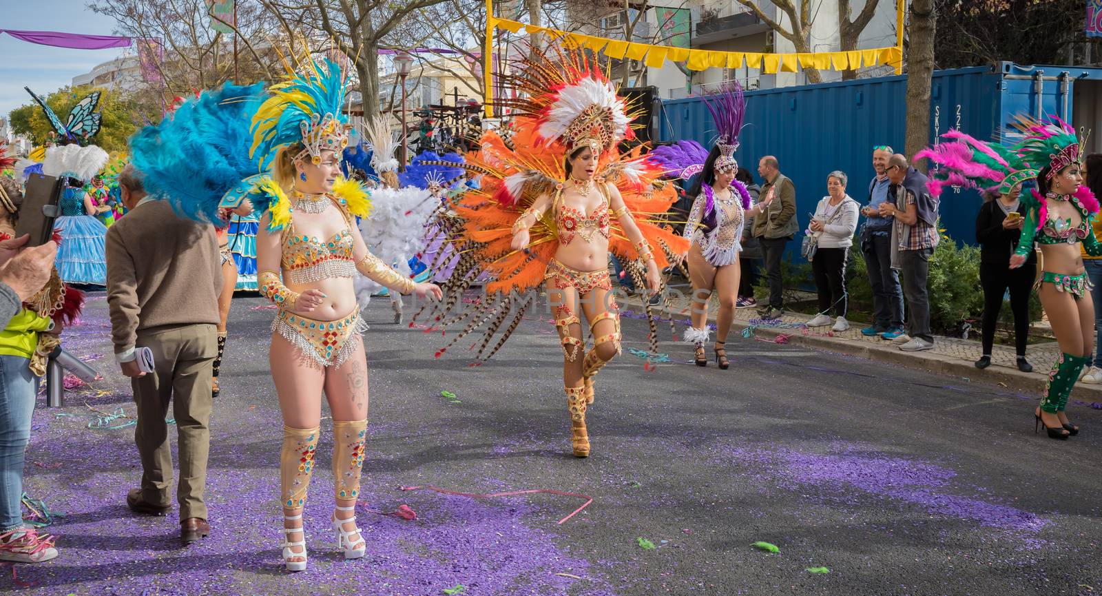 dancers parading in the street in carnival of Loule city, Portug by AtlanticEUROSTOXX