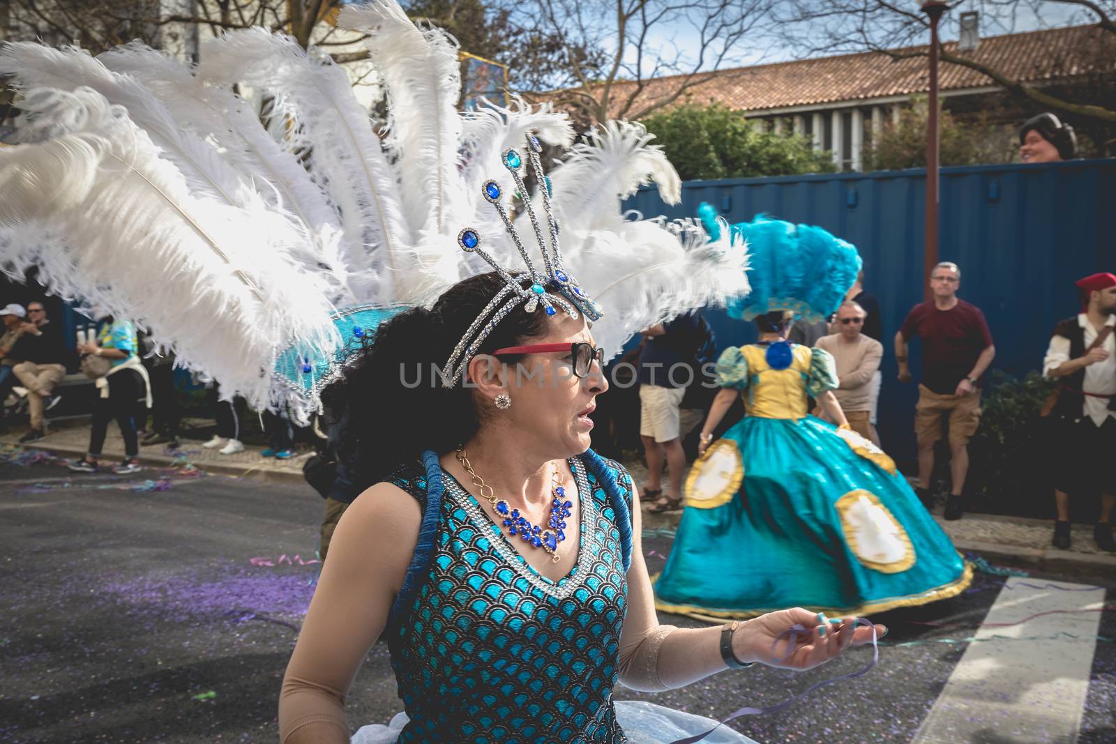 Loule, Portugal - February 25, 2020: dancers parading in the street in front of the public in the parade of the traditional carnival of Loule city on a February day