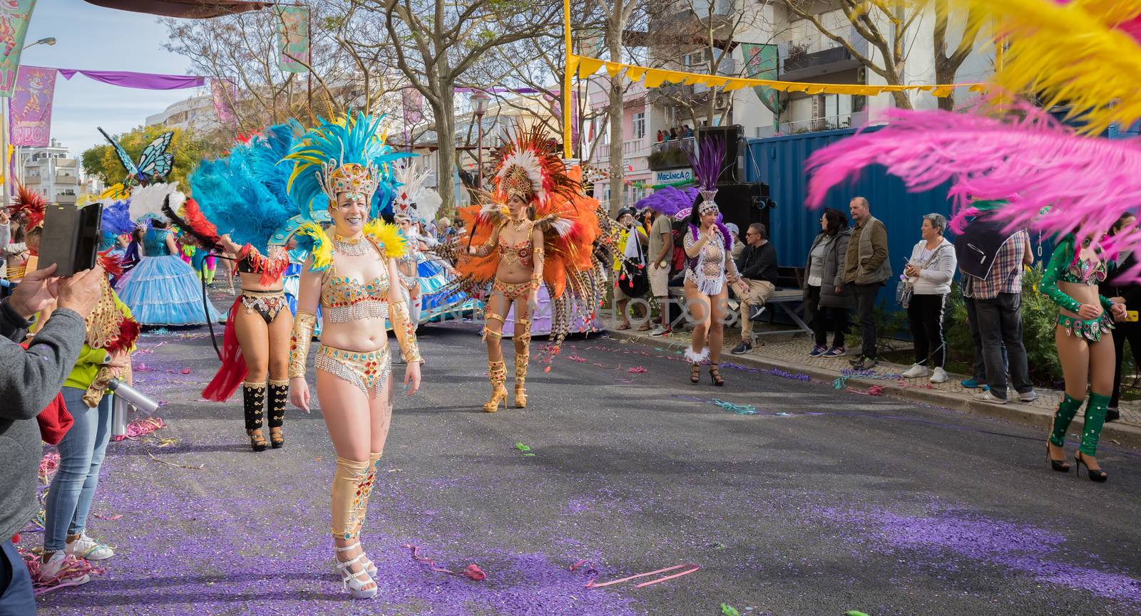 dancers parading in the street in carnival of Loule city, Portug by AtlanticEUROSTOXX