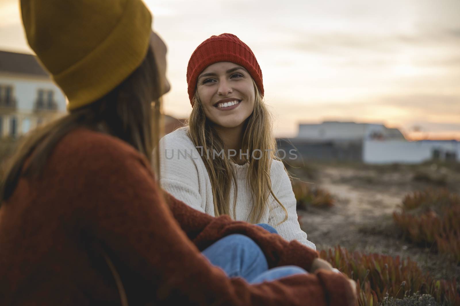 Female friends sitting outside having a chat