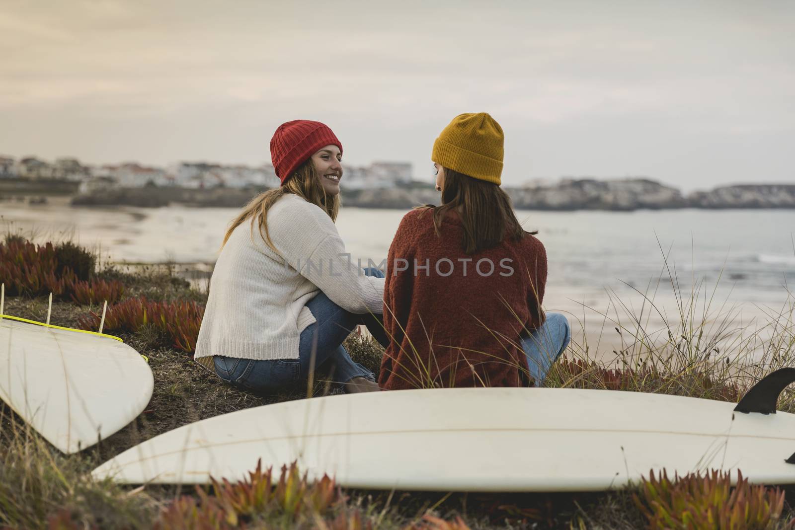 Surfer girls at the beach by Iko