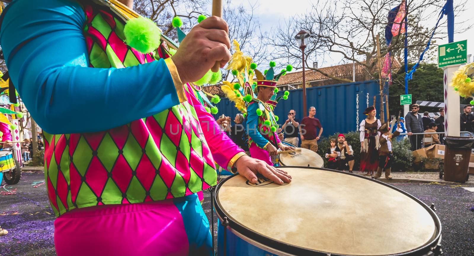 Loule, Portugal - February 25, 2020: percussionists parading in the street accompanying dancers in the parade of the traditional carnival of Loule city on a February day