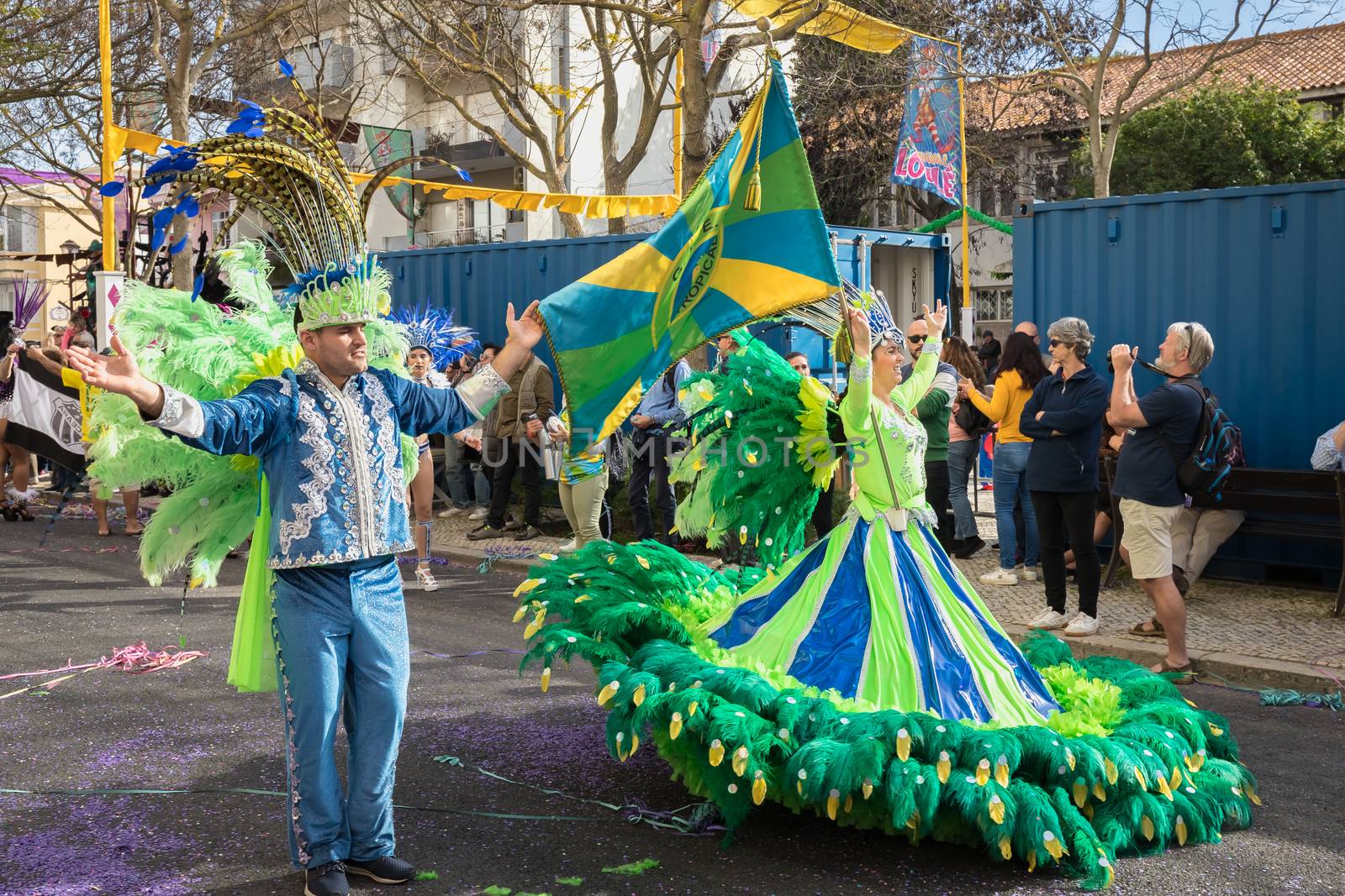 Loule, Portugal - February 25, 2020: dancers parading in the street in front of the public in the parade of the traditional carnival of Loule city on a February day