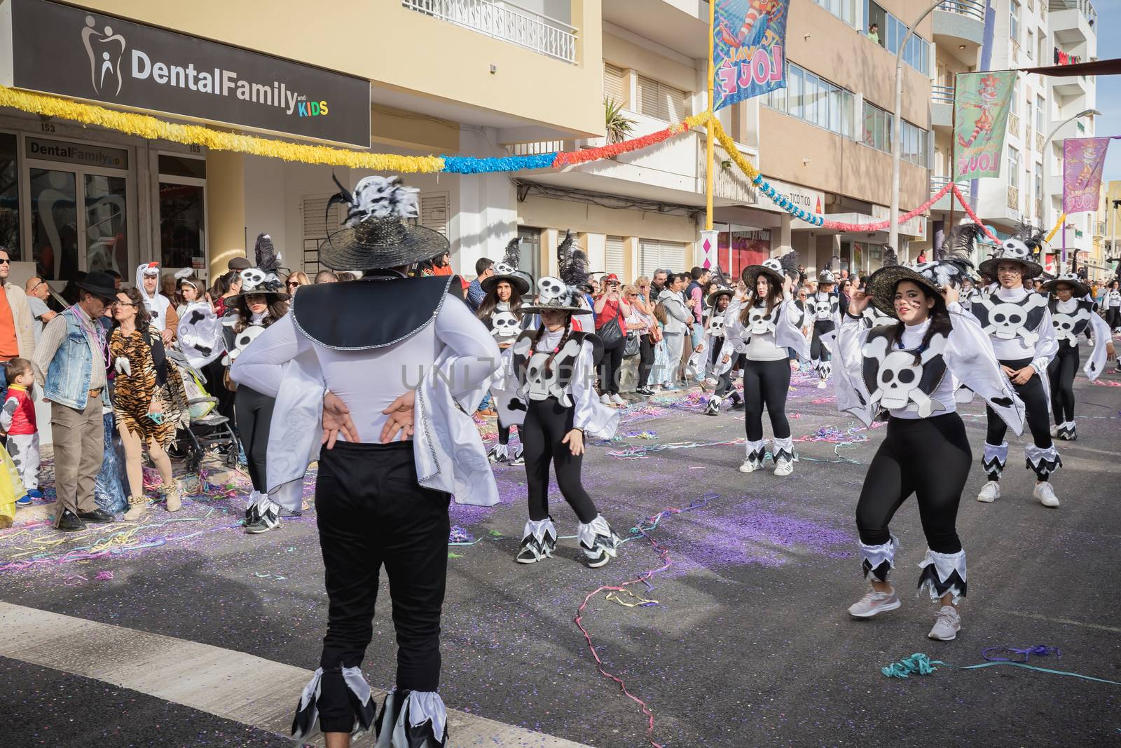 Loule, Portugal - February 25, 2020: dancers parading in the street in front of the public in the parade of the traditional carnival of Loule city on a February day