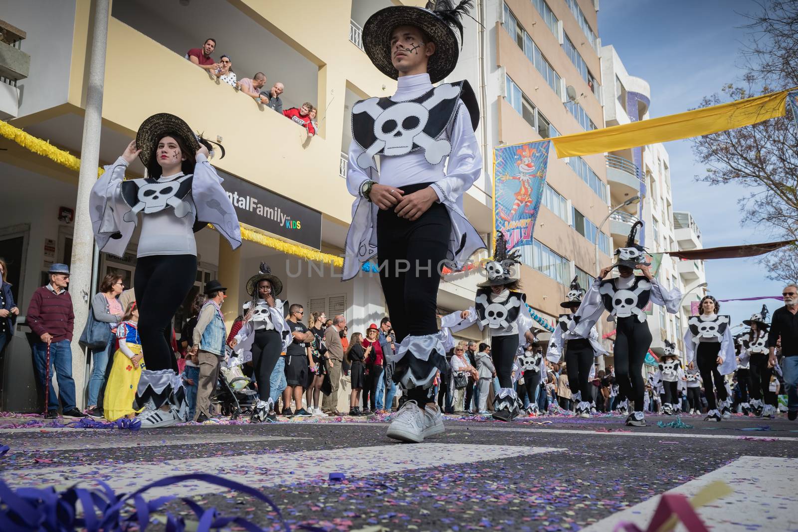 Loule, Portugal - February 25, 2020: dancers parading in the street in front of the public in the parade of the traditional carnival of Loule city on a February day