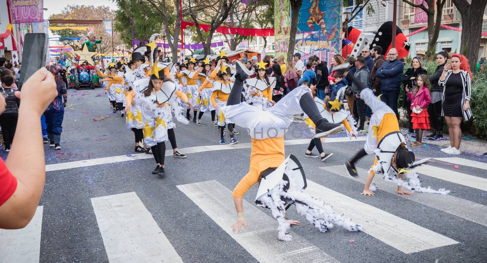 dancers parading in the street in carnival of Loule city, Portug by AtlanticEUROSTOXX