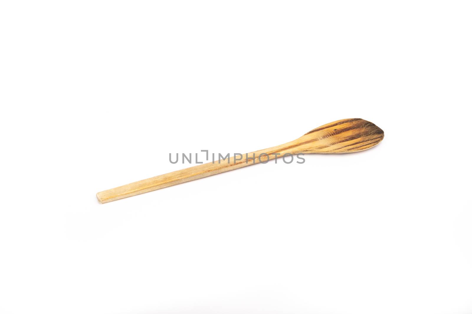 wooden kitchen spoon on white background in studio