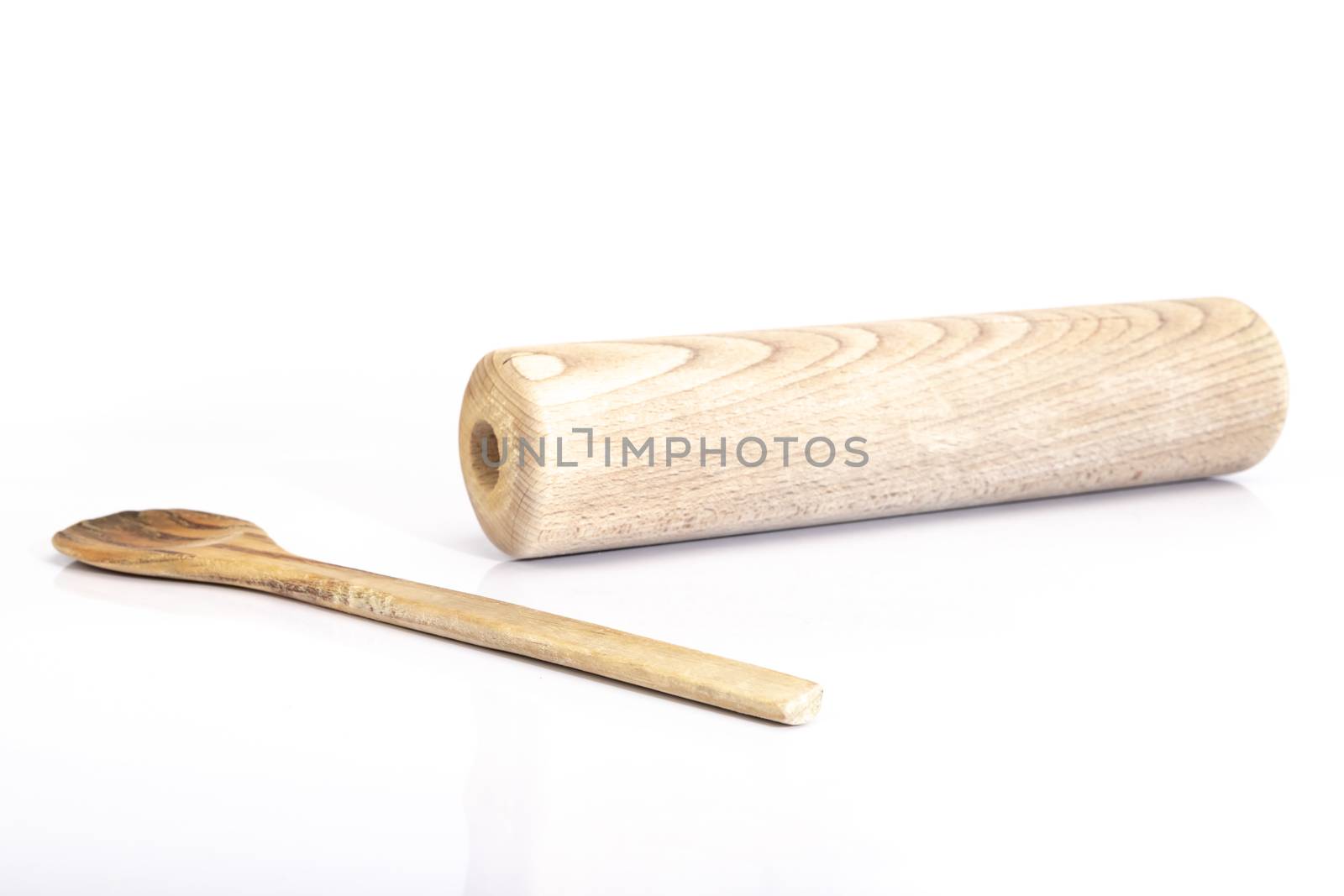 wooden spoon and rolling pin on white background in studio