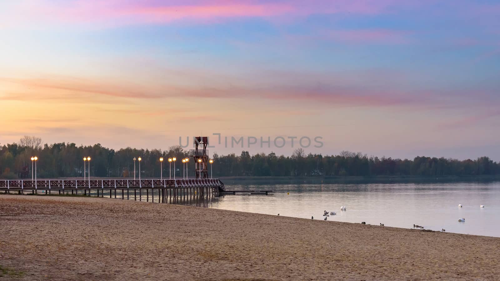 Autumn view of beach and pier at Pogoria III lake by mkos83