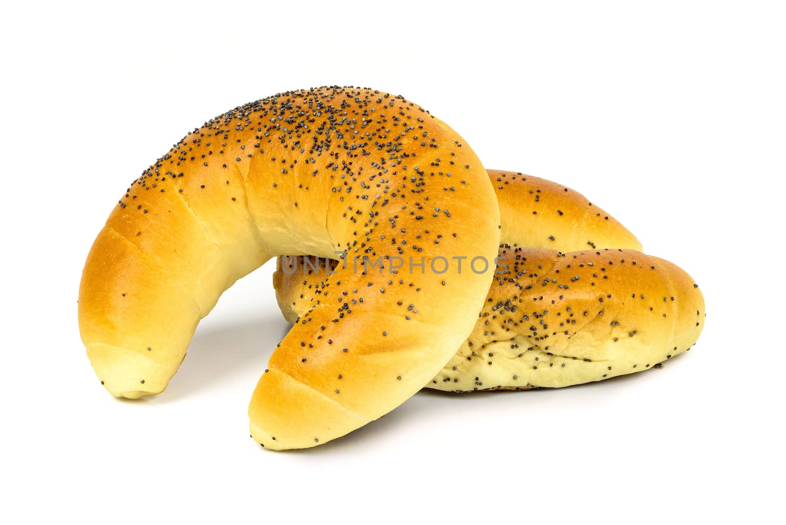 Crescent rolls with poppy seeds isolated on white background with clipping path