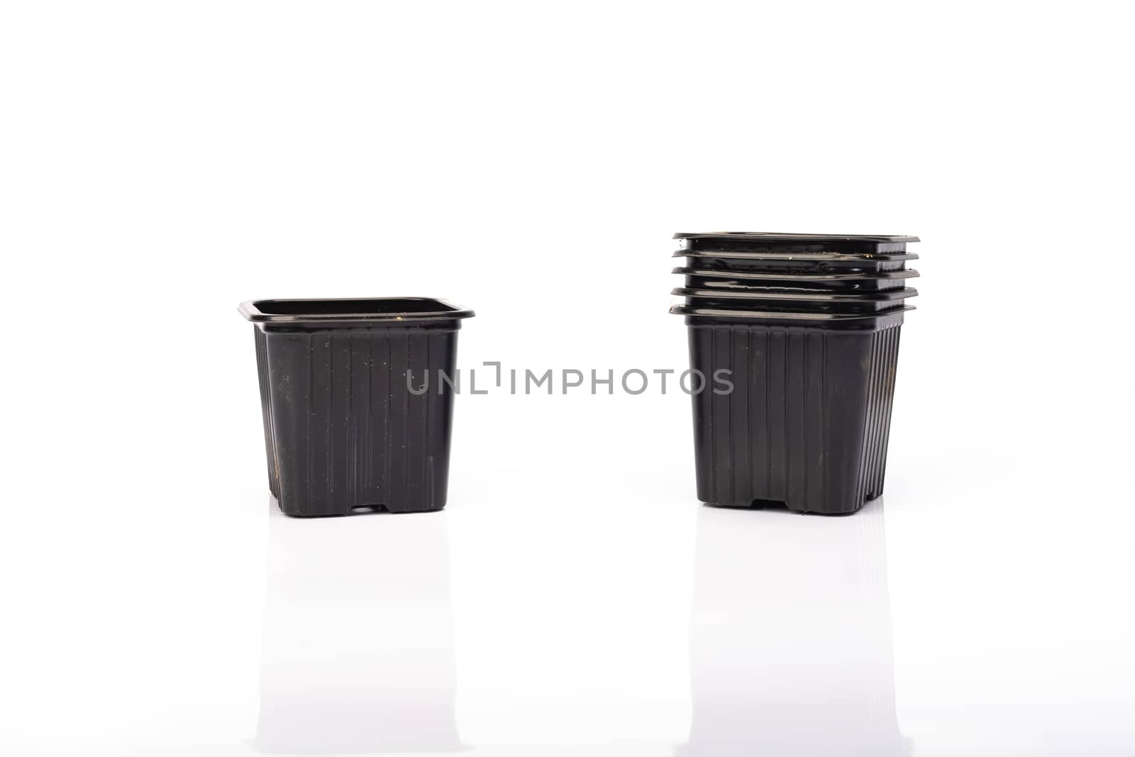 used black plastic gardening bucket  by AtlanticEUROSTOXX