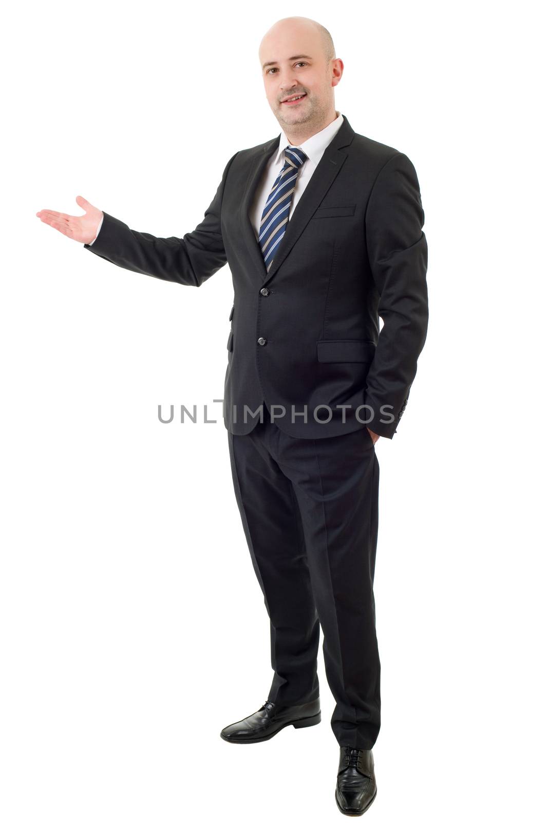 Handsome businessman with arm out in a welcoming gesture, isolated on white