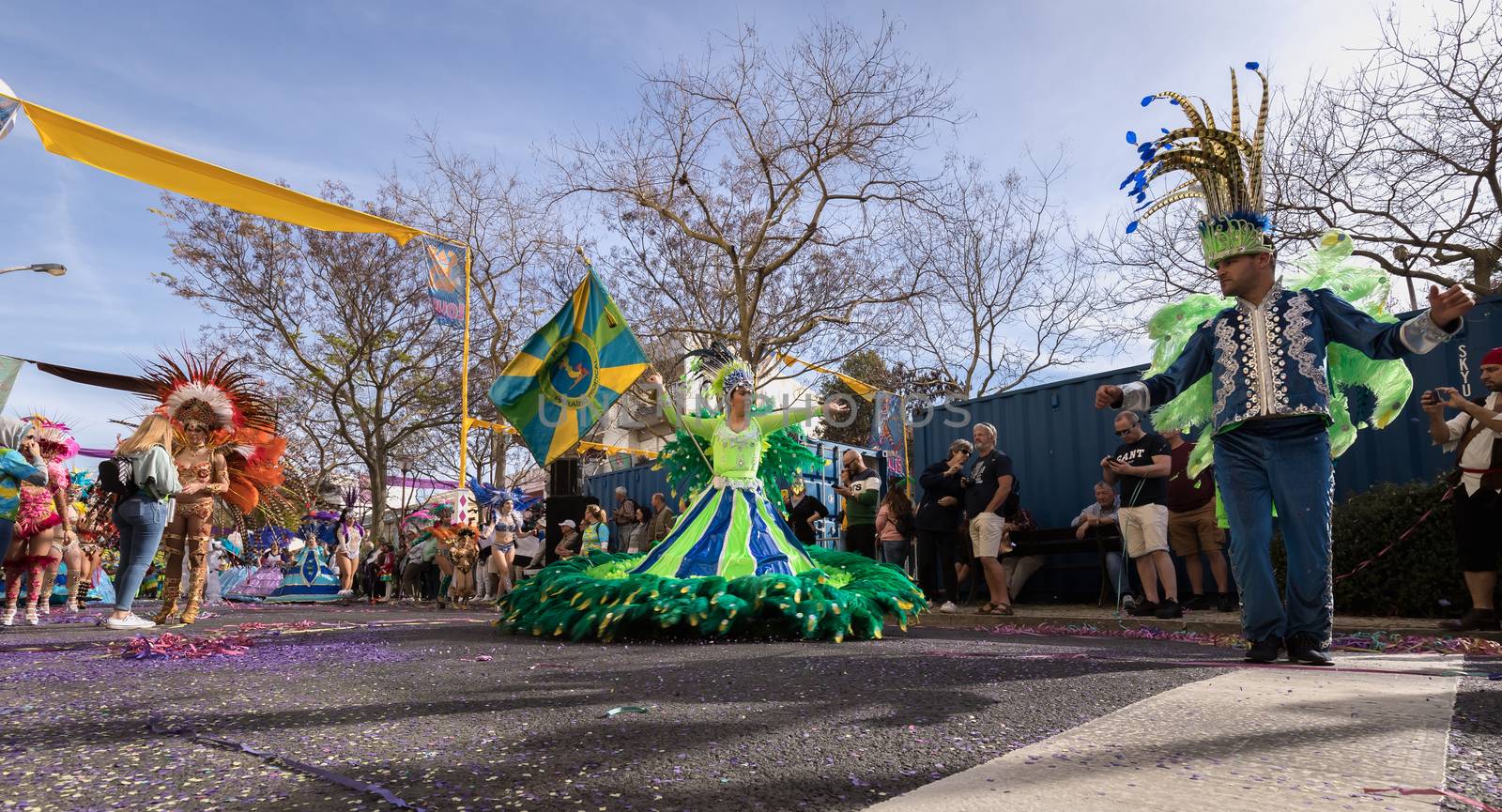 Loule, Portugal - February 25, 2020: dancers parading in the street in front of the public in the parade of the traditional carnival of Loule city on a February day