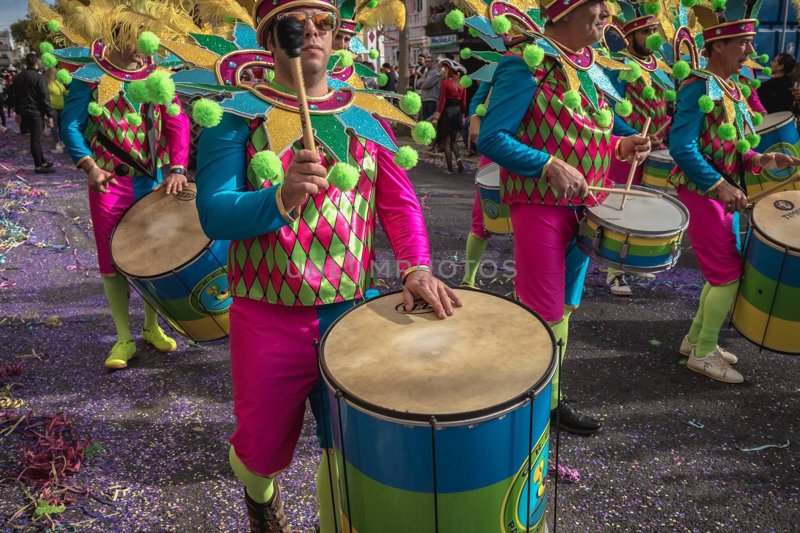 Loule, Portugal - February 25, 2020: percussionists parading in the street accompanying dancers in the parade of the traditional carnival of Loule city on a February day