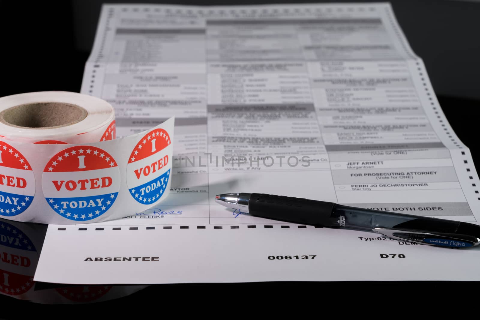 Morgantown, WV - 21 May 2020: West Virginia state primary election absent ballot form with focus on the word Absentee and on I Voted Today sticker