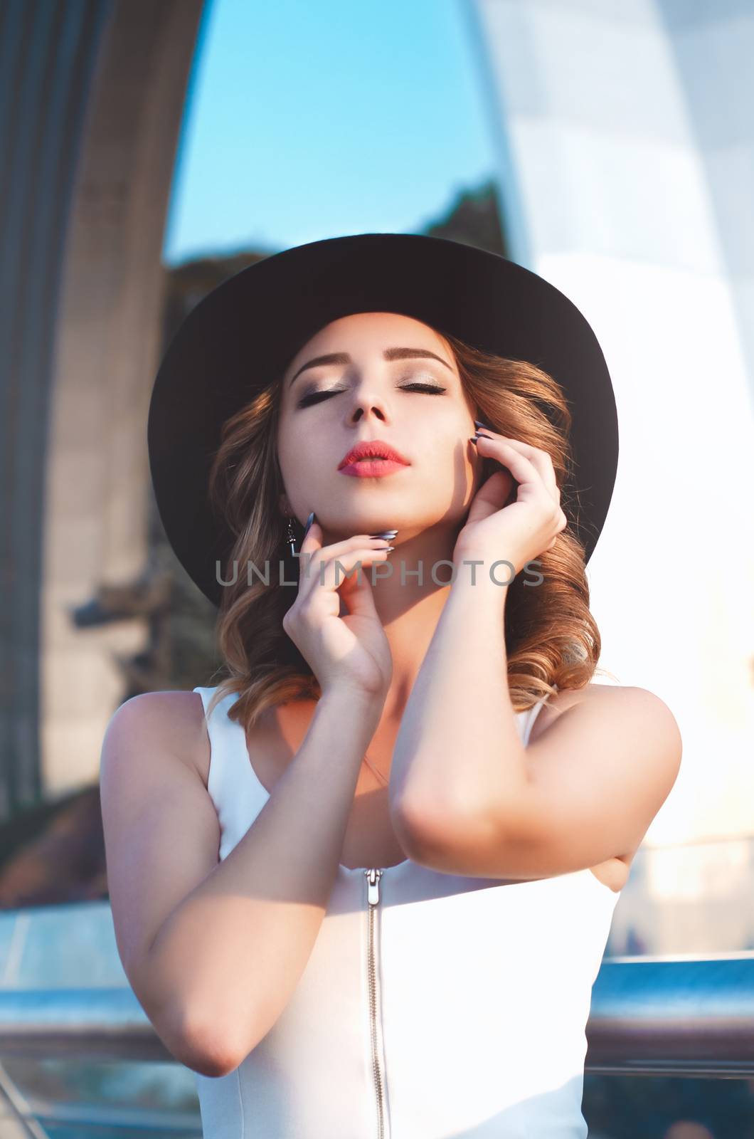 Close-up Fashion woman portrait of young pretty trendy girl posing at the city in Europe,spring fall street fashion,looking to the side and smiling portrait.trendy.