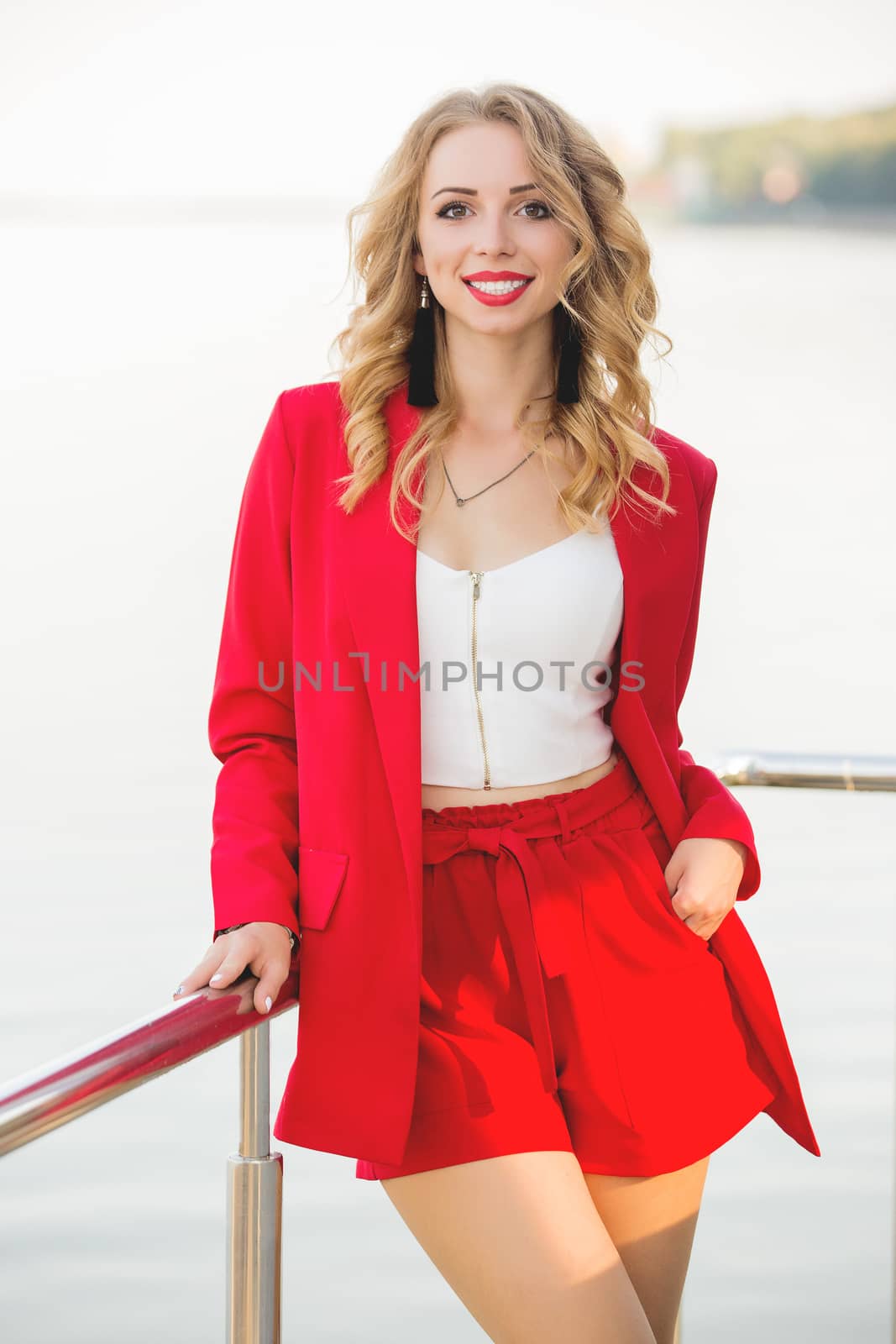 Business attractive woman in city wear red business suit, bussinestyle for women