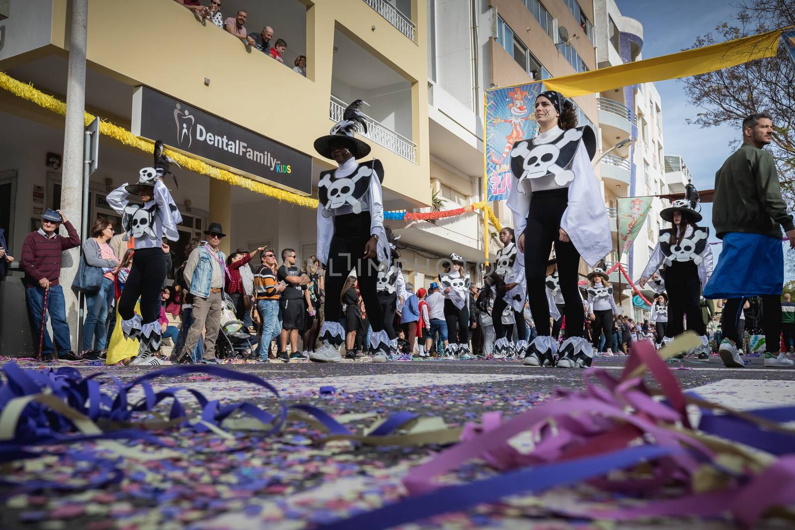 Loule, Portugal - February 25, 2020: dancers parading in the street in front of the public in the parade of the traditional carnival of Loule city on a February day