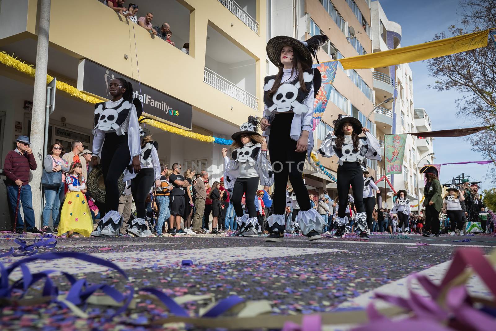 Loule, Portugal - February 25, 2020: dancers parading in the street in front of the public in the parade of the traditional carnival of Loule city on a February day