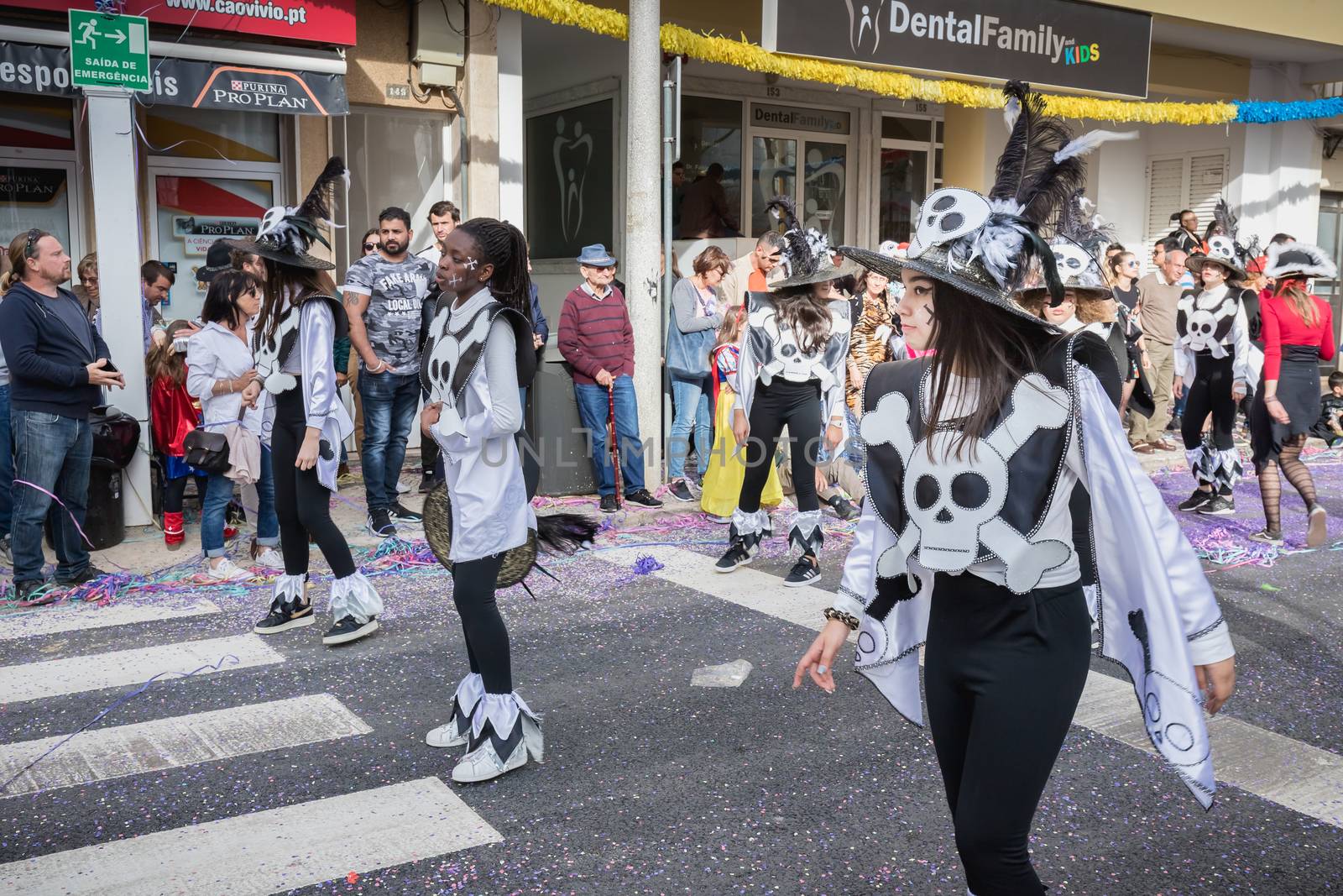 Loule, Portugal - February 25, 2020: dancers parading in the street in front of the public in the parade of the traditional carnival of Loule city on a February day