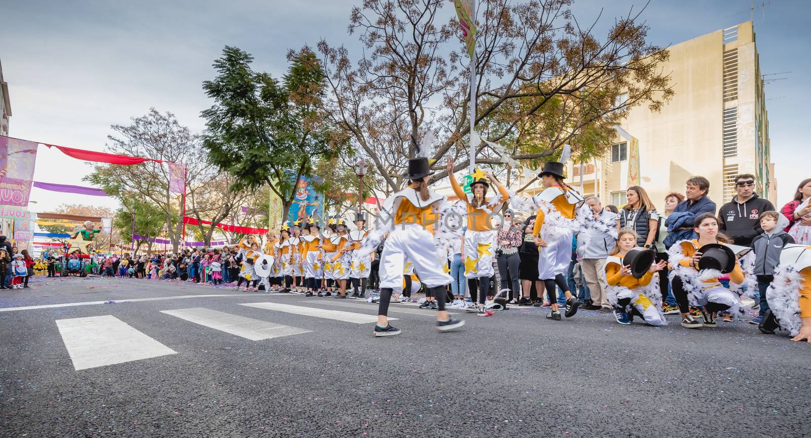 dancers parading in the street in carnival of Loule city, Portug by AtlanticEUROSTOXX