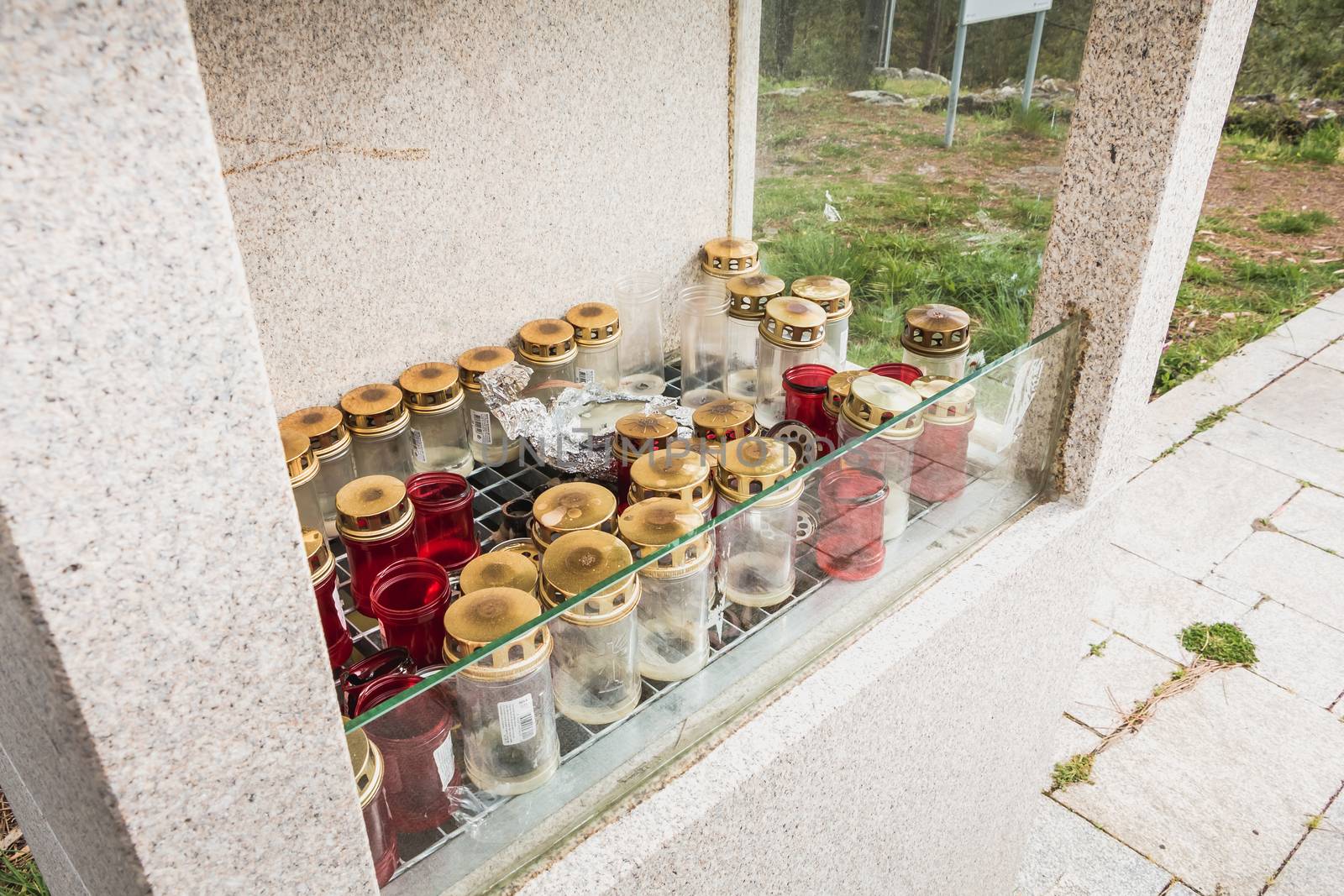 Vila Cha near Esposende, Portugal - May 9, 2018: candlestick protected by a glass outside the chapel of S. Lourenco on the heights of the city on a spring day