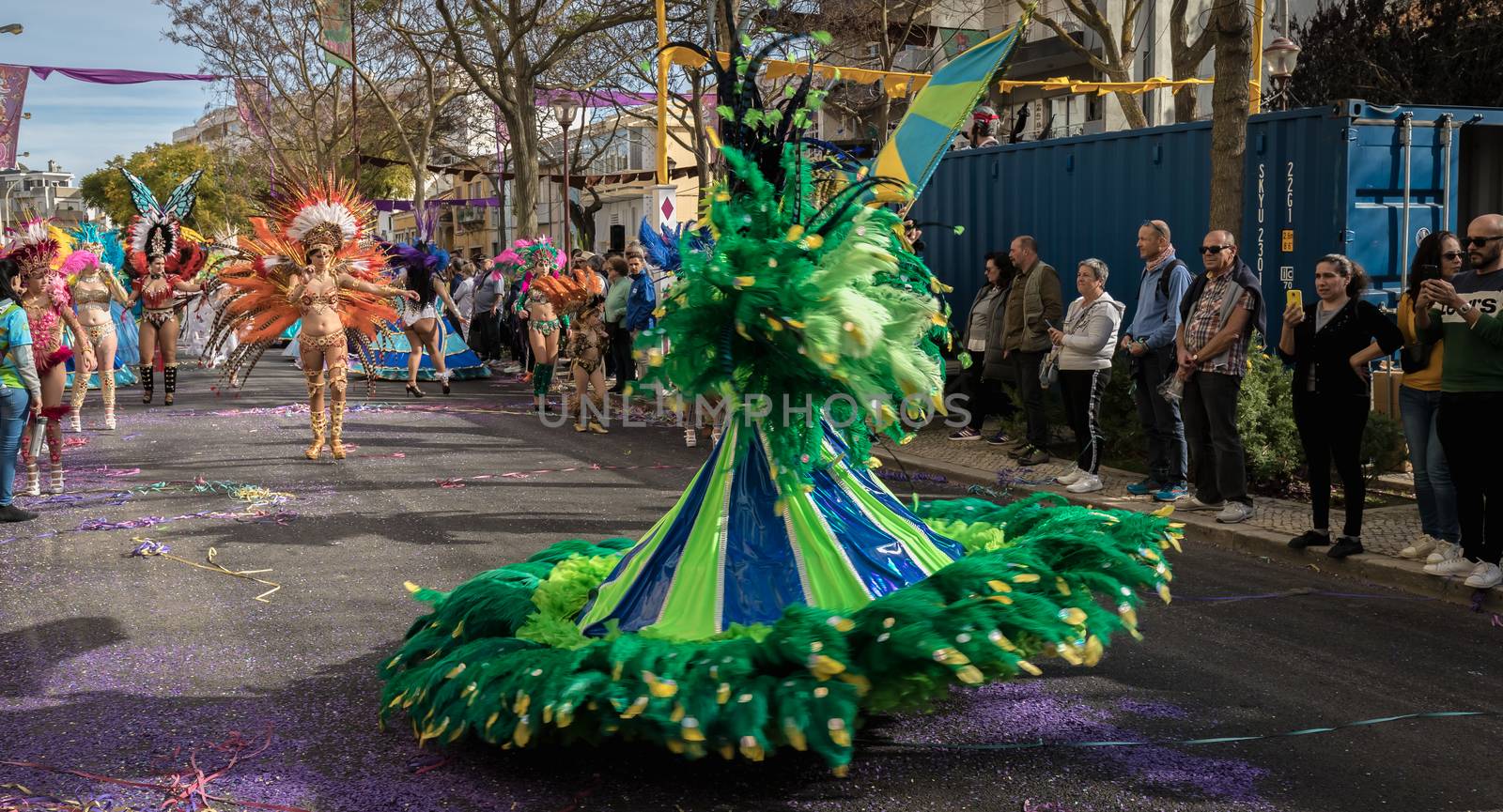 Loule, Portugal - February 25, 2020: dancers parading in the street in front of the public in the parade of the traditional carnival of Loule city on a February day