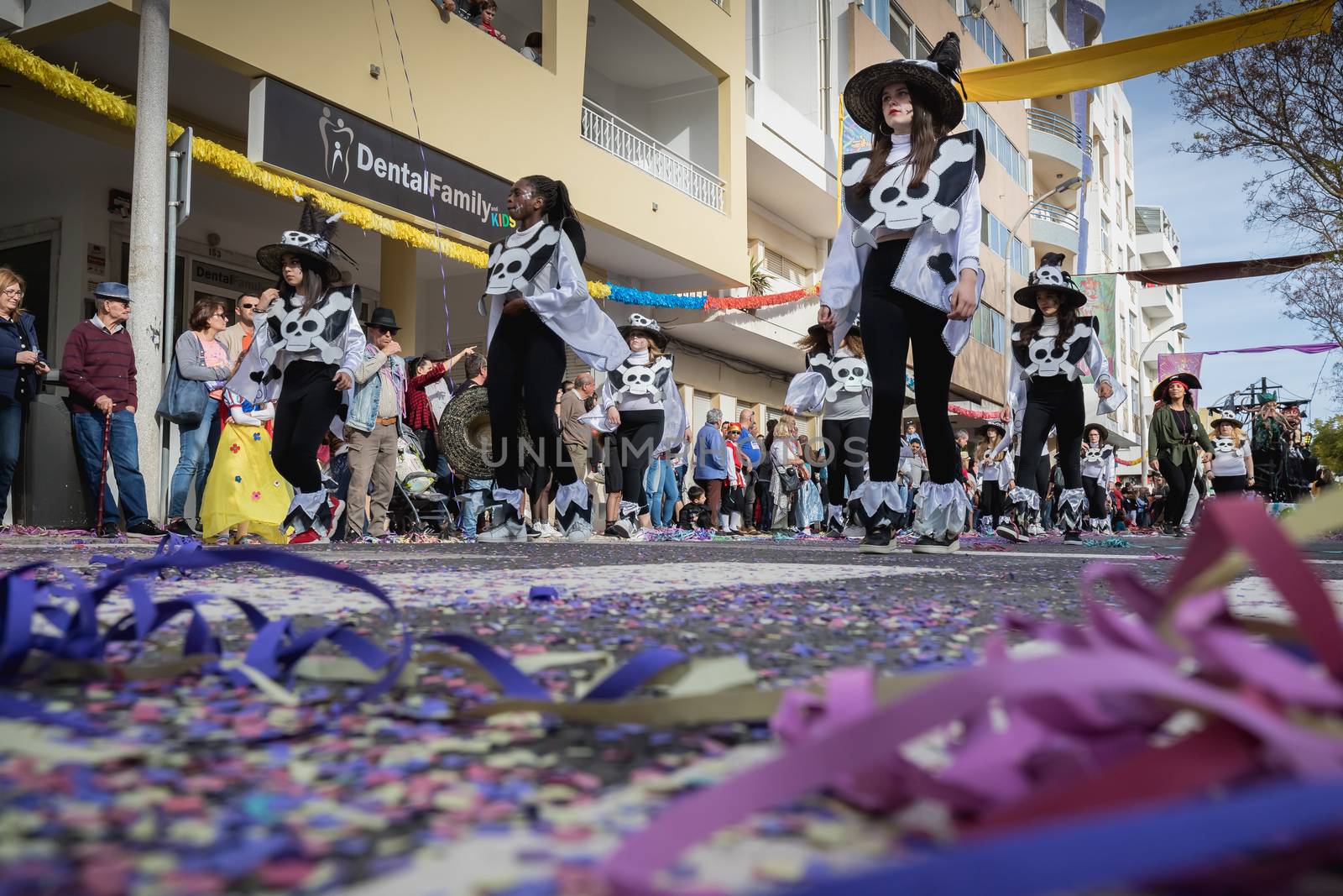 Loule, Portugal - February 25, 2020: dancers parading in the street in front of the public in the parade of the traditional carnival of Loule city on a February day