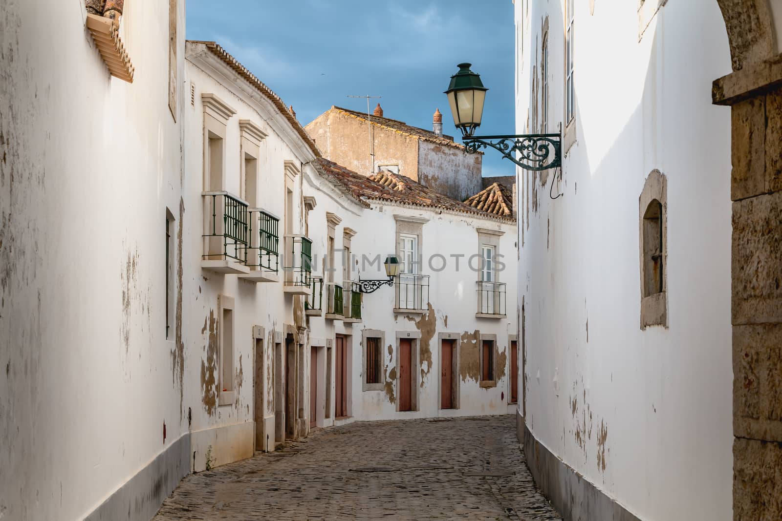 Faro, Portugal - May 1, 2018: Detail of architecture of the streets of the city center with typical construction on a spring day