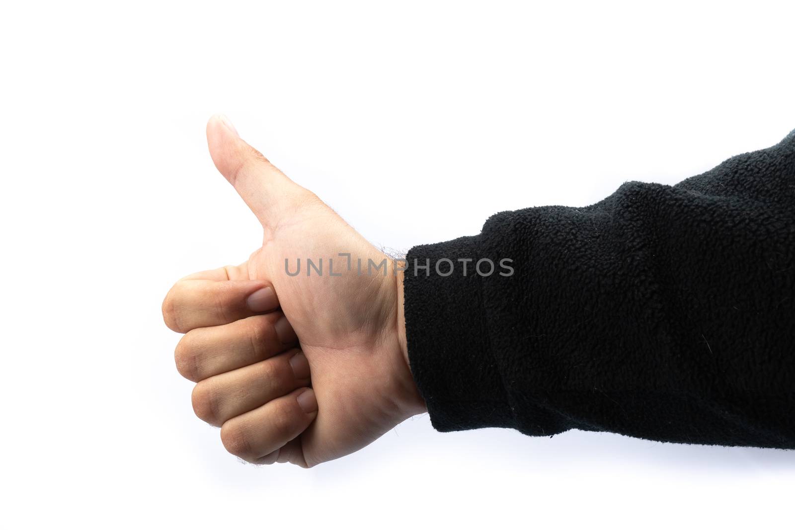 caucasian hand showing thumb on white background in studio