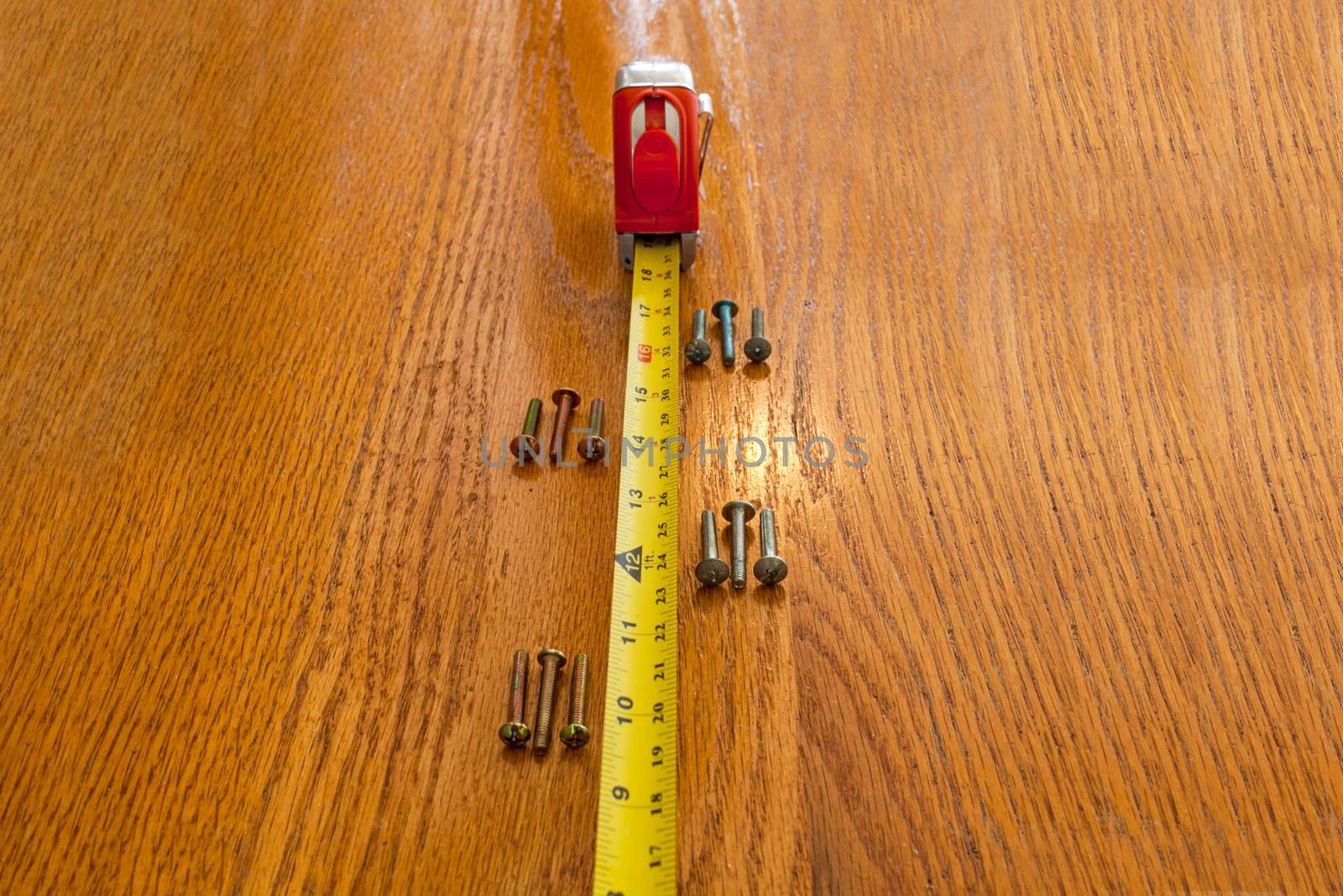 Screws and a tape measure by quackersnaps