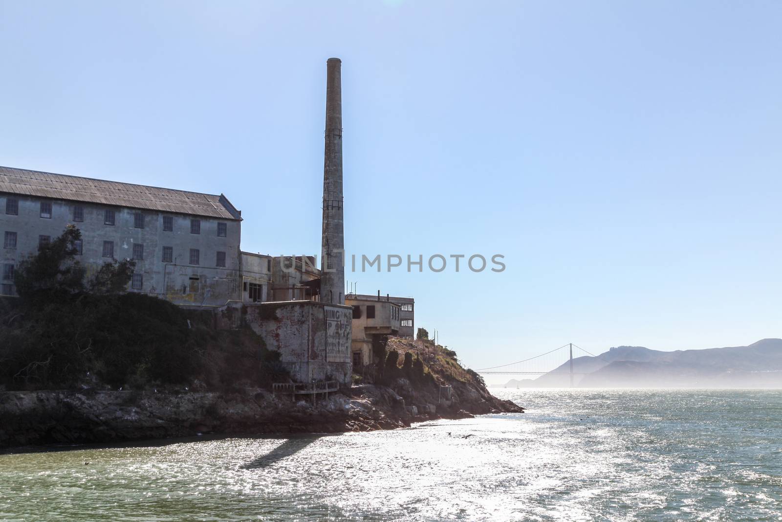 The Alcatraz prison in San Francisco with Golden Gate Bridge behind