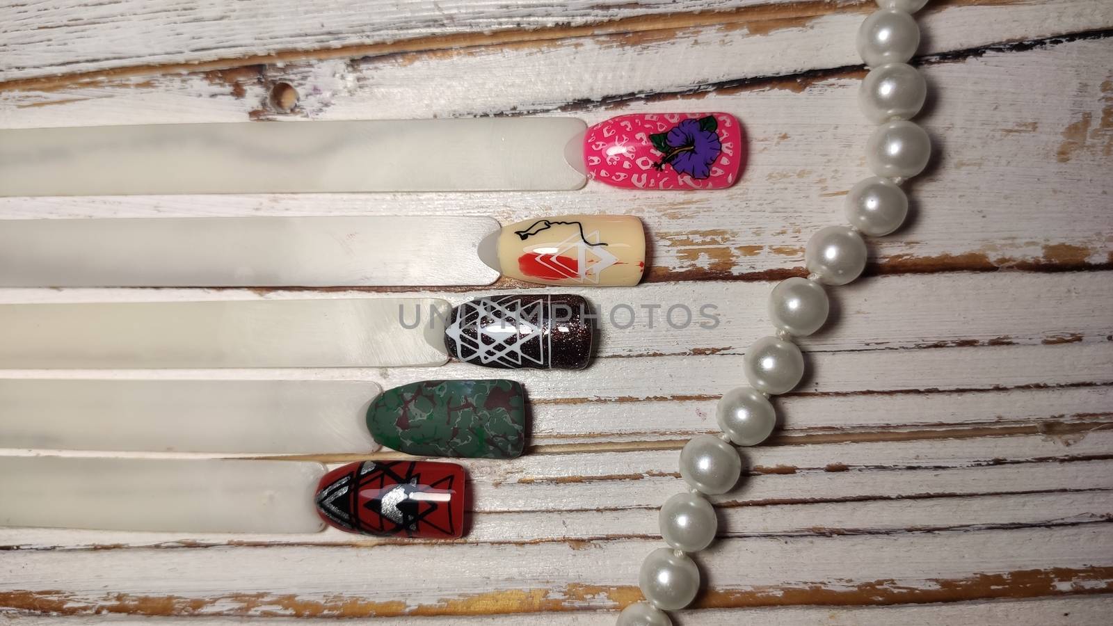 Nail art design wheel. Set of false nails for manicure. by SmirMaxStock