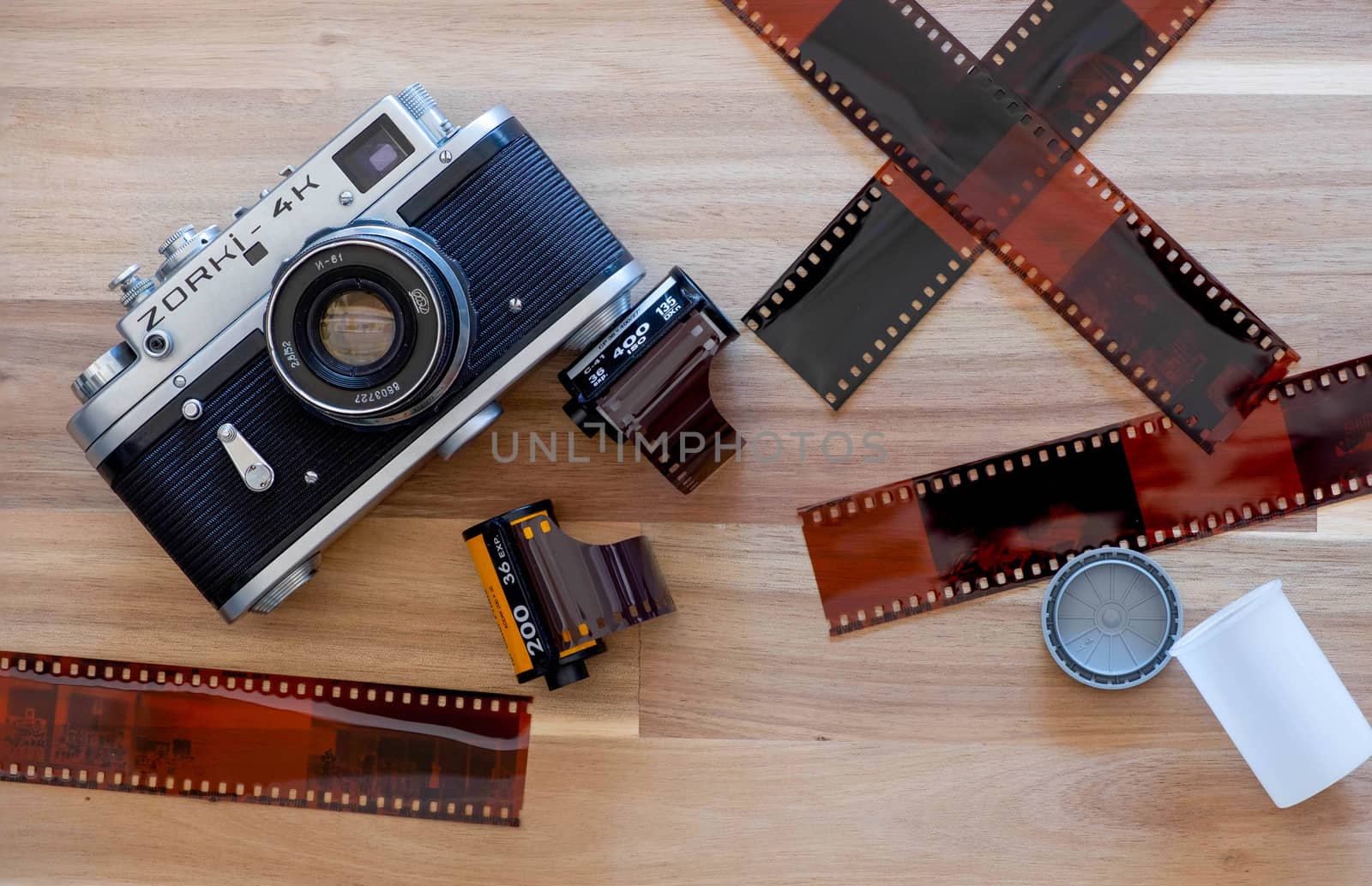 The Russian Film Camera Zorki 4K with Kodak film and Lomography film and film sheet on wooden background
