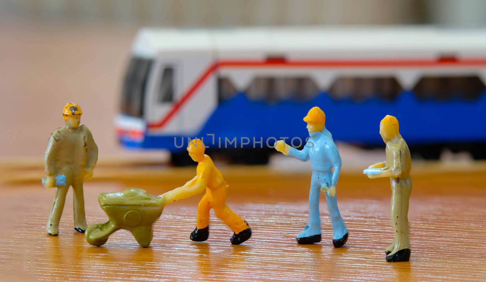 group of miniature Worker meeting to repair The  Train