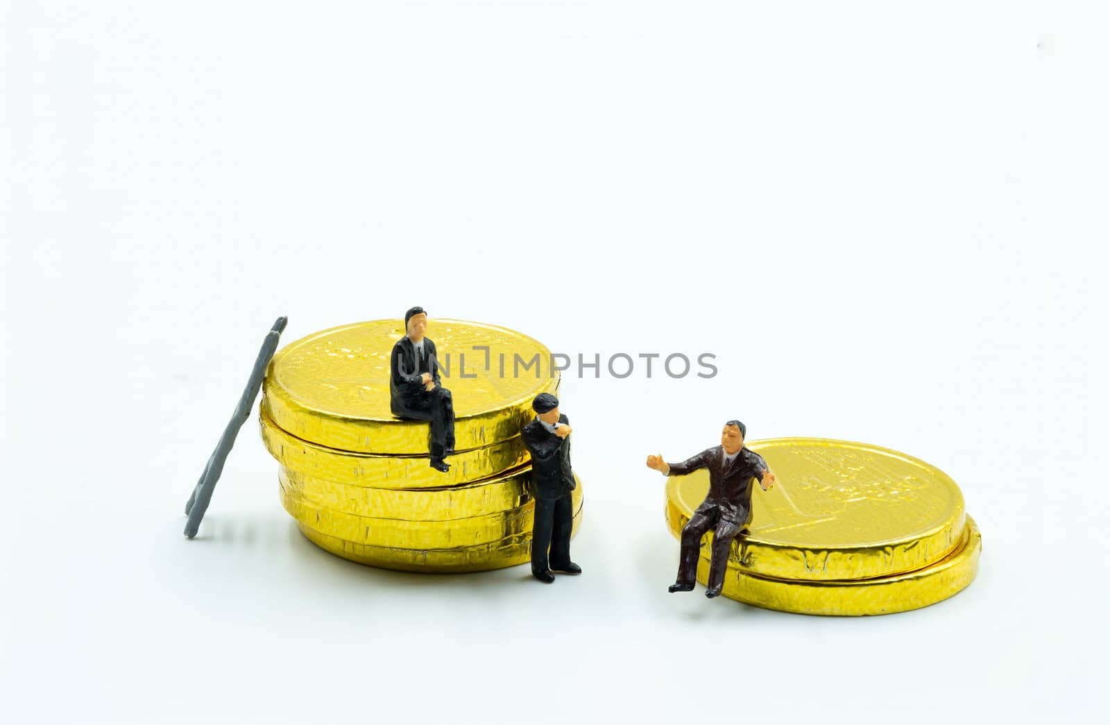 miniature figure a group of business men sitting on top of pile  by Bonn2210