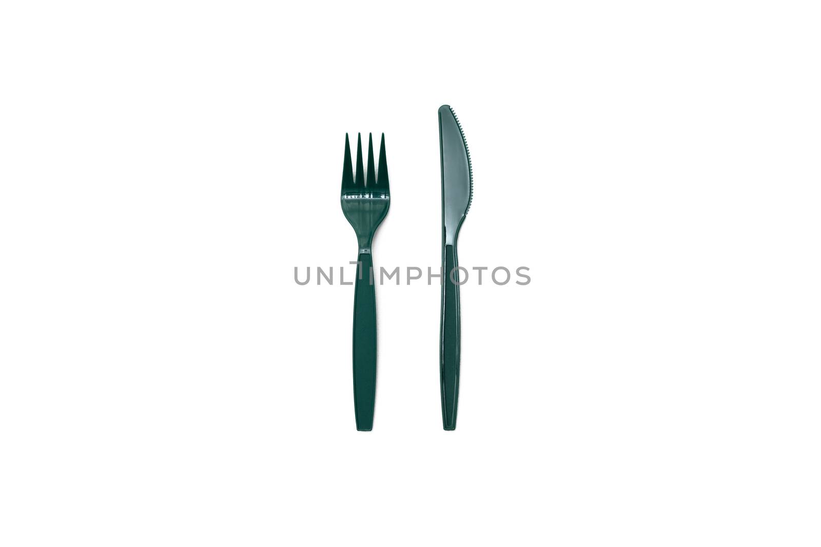 Green plastic knife and fork isolated on white background.