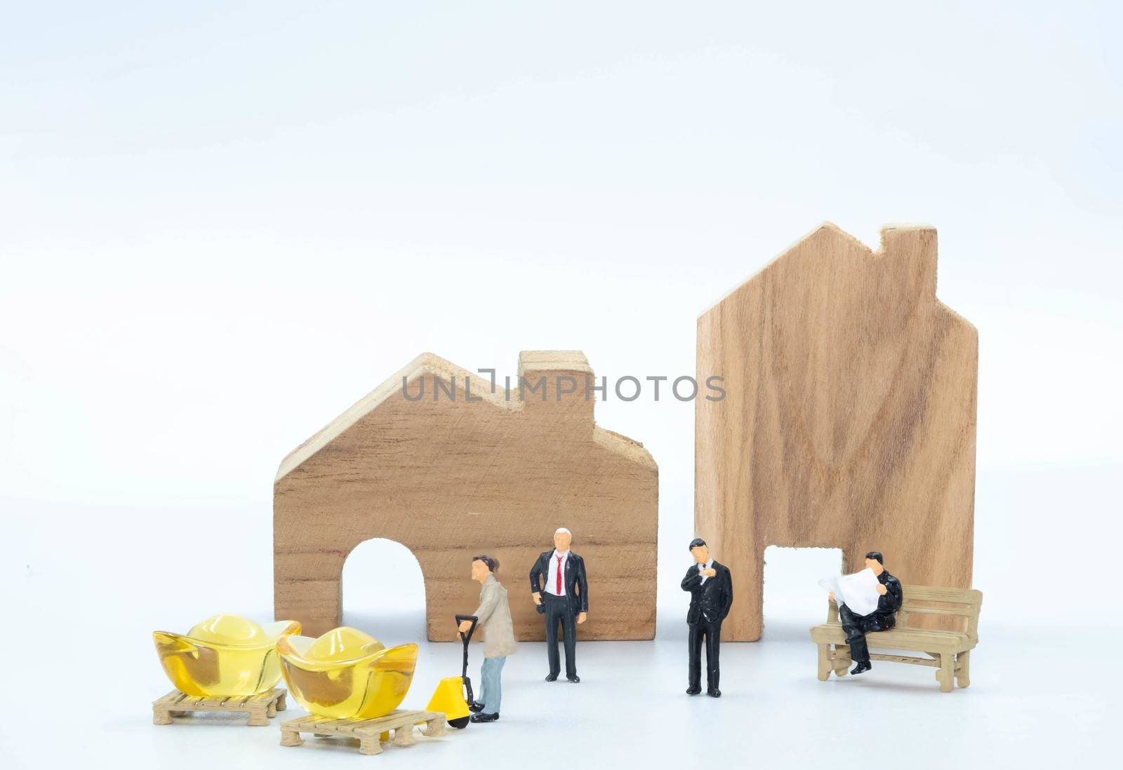 miniature business man with Worker carry the Gold to buy building and Land isolate on white background Investiment  Concept