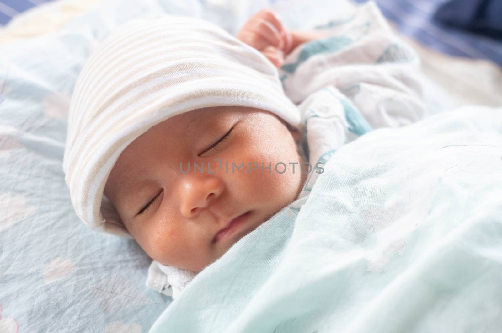 The Sleeping cute New Born Baby infant with hat  on the bed by Bonn2210