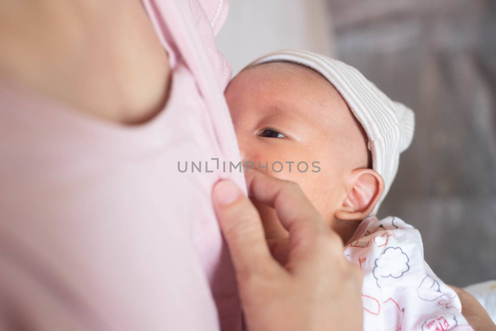 Baby feeds on mother's breasts milk