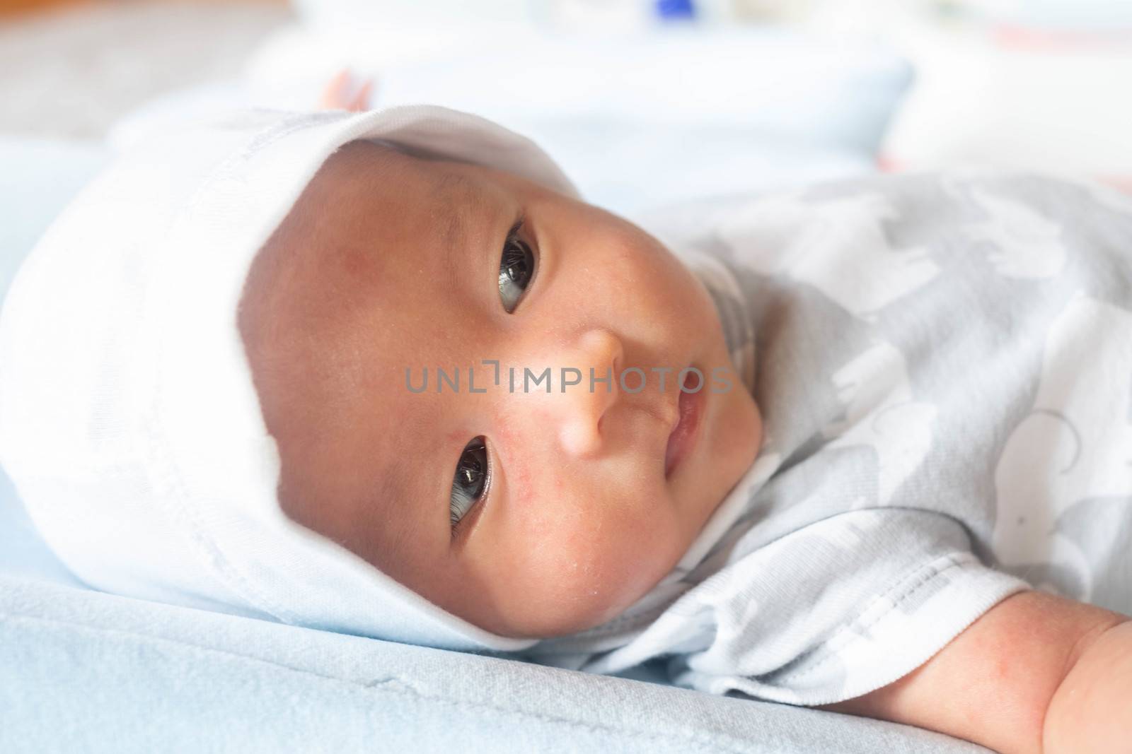 Portrait Photo of happy newborn baby infant with big black eyes  by Bonn2210