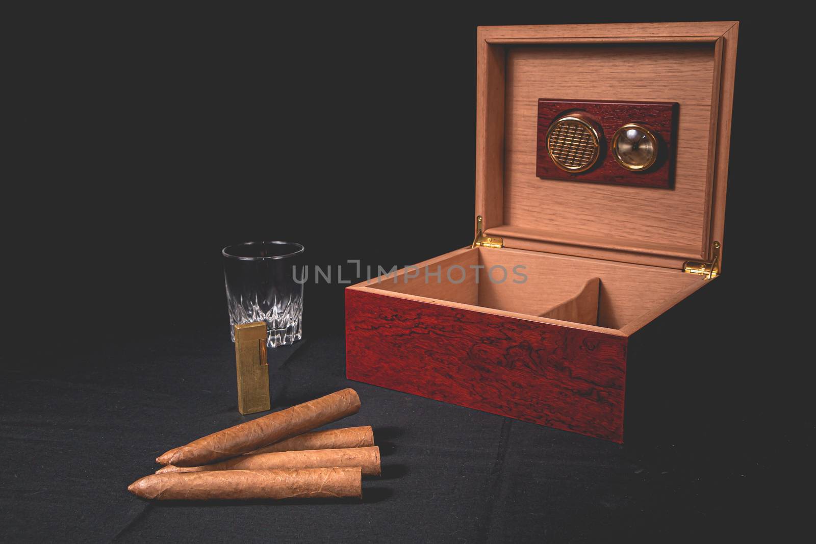 Cigar box on black background and lighter by AtlanticEUROSTOXX