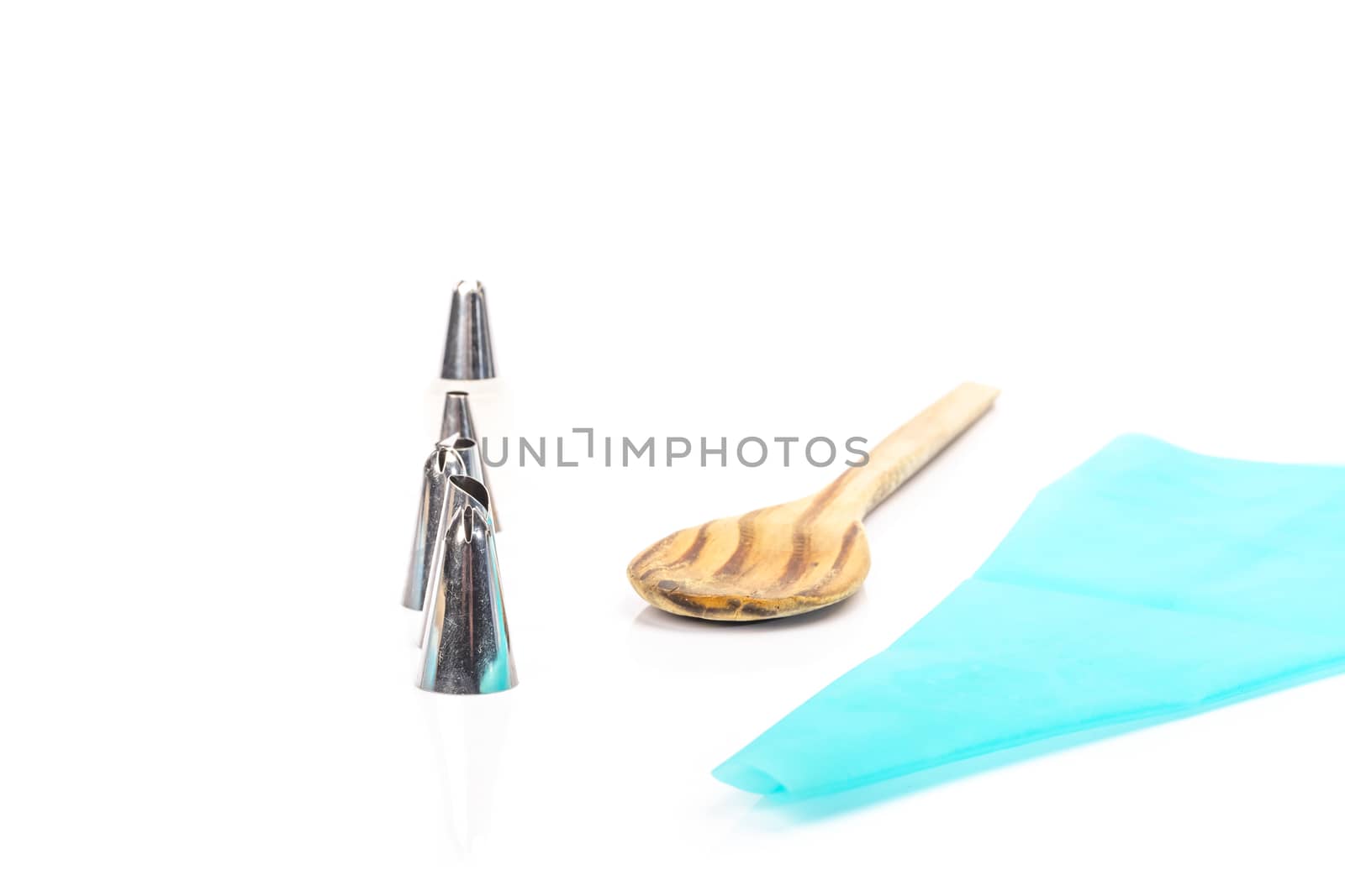 pastry bag and pastry accessories on white background in studio