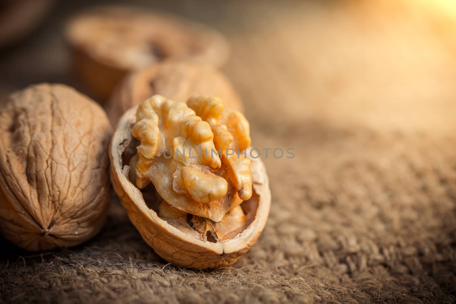 still life with Walnut kernels and whole walnuts  by photosam