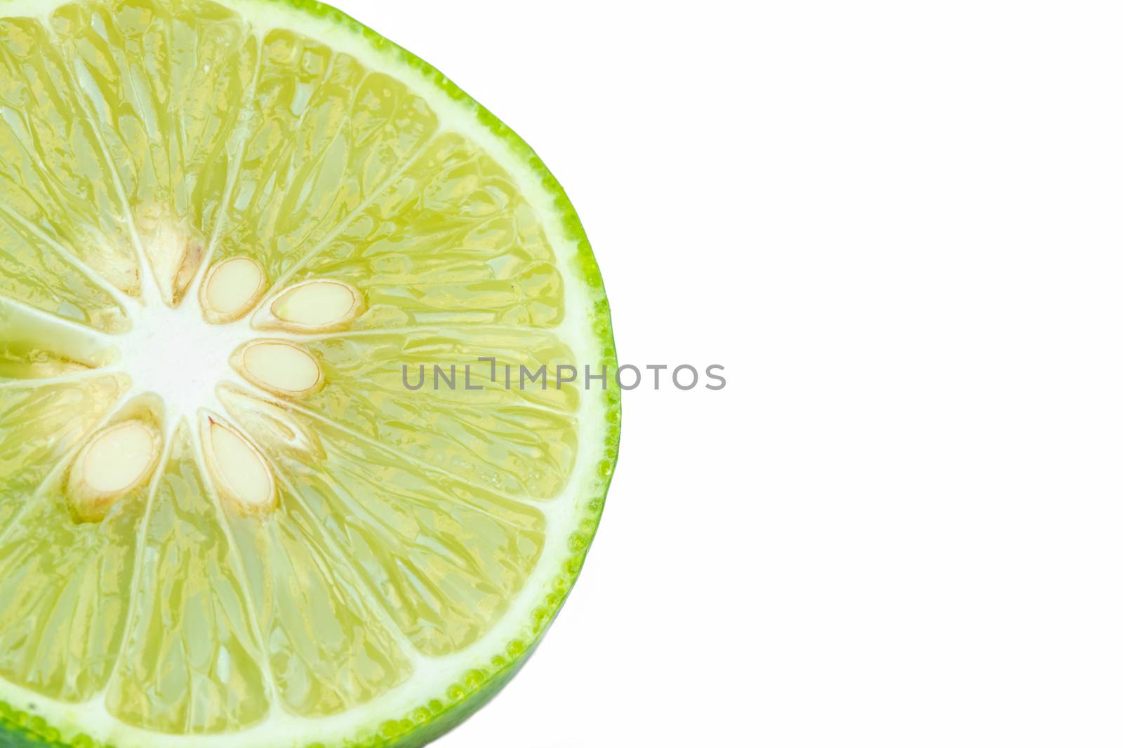 Close up green lemons with half  isolated on white background