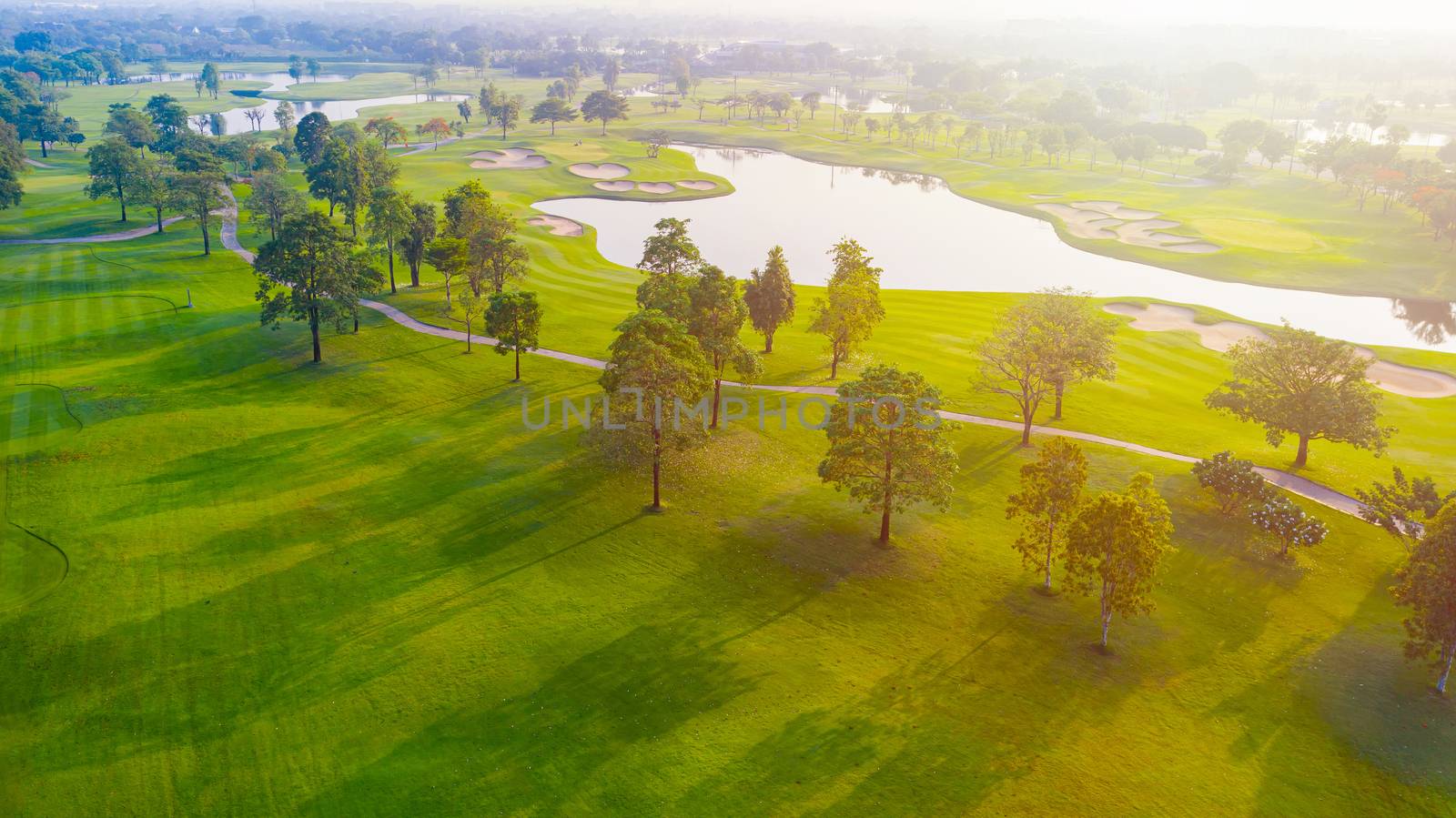 Aerial view of golf field landscape with sunrise view in the morning shot. Bangkok Thailand