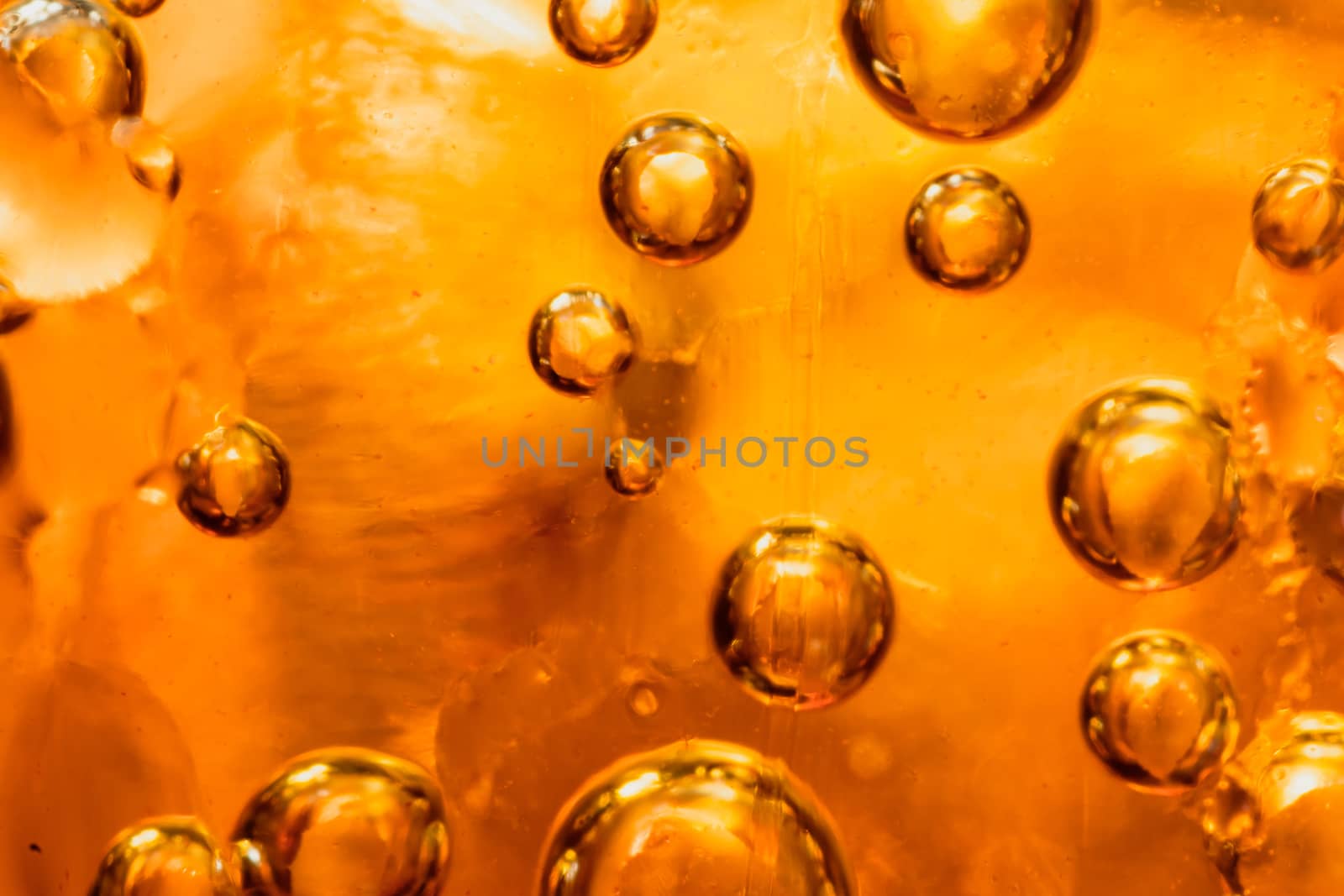 abstract water with  bubbles soars over a golden background