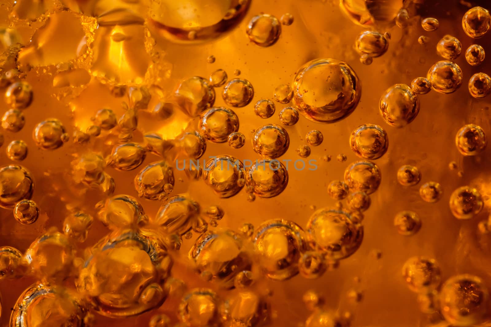 abstract water with  bubbles soars over a golden background